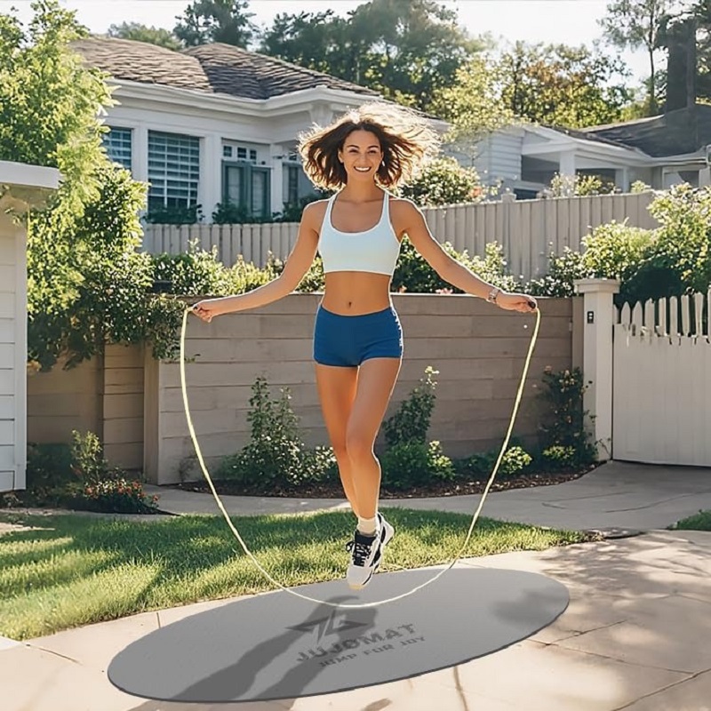 a woman is jumping with rope