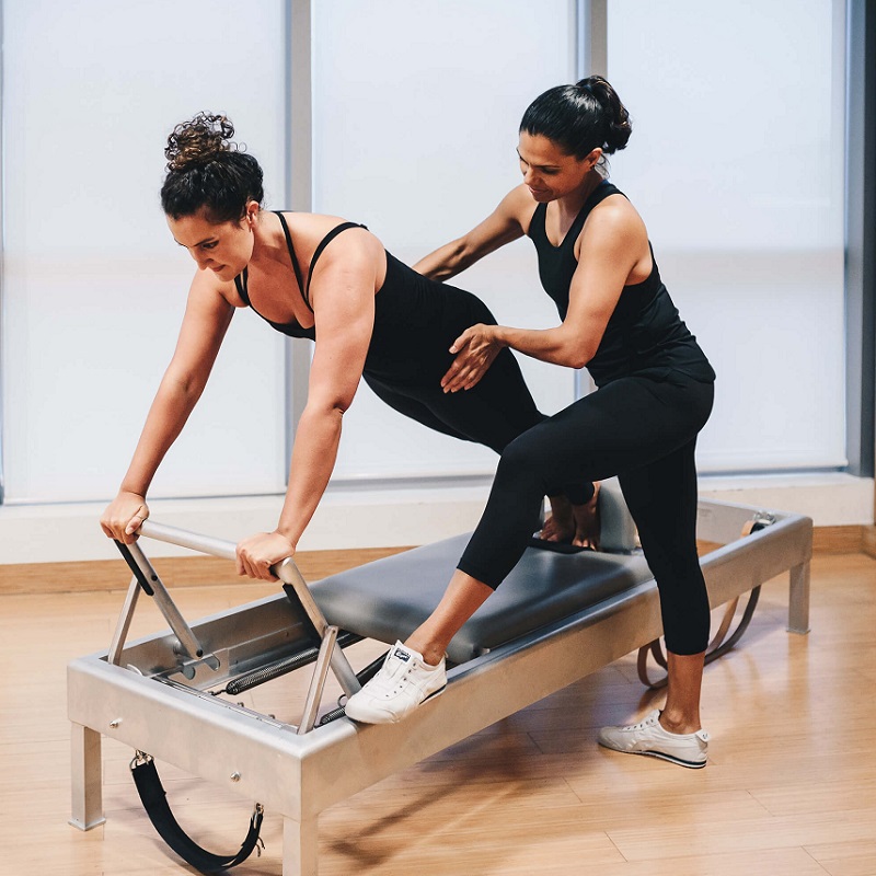 pilates instructor and student